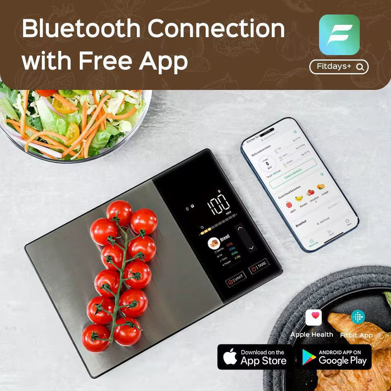 Bluetooth food scale syncing data to Fitdays app on smartphone next to fresh tomatoes