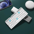 Mini folding Bluetooth wireless keyboard with stand, supports 3 devices, rechargeable, ideal for phone and tablet use.