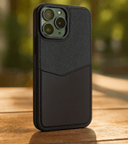 Black Dual-Tone Fabric & PU Leather Case for iPhone 14 Pro Max | 13,15 & 16 Pro Max on a wooden surface with a blurred natural background